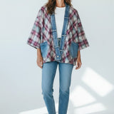 Model wearing a Broderick's Clothing Co. Shannon Passero Ruthie plaid cardigan with denim trim and patch pockets.