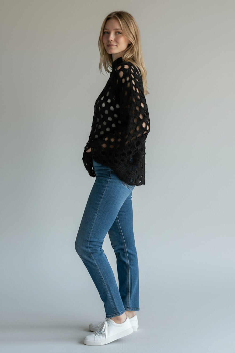 Broderick's Clothing Co. Shannon Passero Tara black open-knit high-neck pullover sweater worn with blue jeans