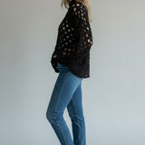 Broderick's Clothing Co. Shannon Passero Tara black open-knit high-neck pullover sweater worn with blue jeans