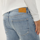 Broderick's Clothing Co. Silver Jeans Co. Machray light wash slim straight knit flex jeans with tan leather back patch