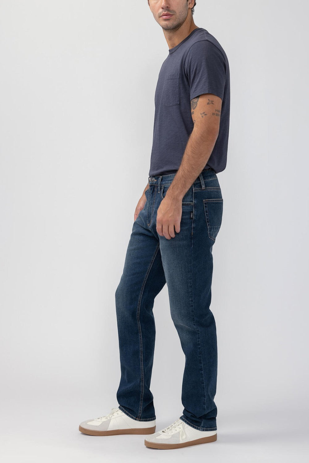 Broderick's Clothing Co. Silver Jeans Co. Machray straight leg denim jeans in dark blue worn by a male model