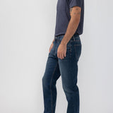 Broderick's Clothing Co. Silver Jeans Co. Machray straight leg denim jeans in dark blue worn by a male model