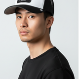Broderick's Clothing Co. Goorin Bros. black and white trucker hat with skull and crossbones patch on a male model