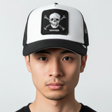 Broderick's Clothing Co. Goorin Bros. black and white trucker hat with skull and crossbones patch on a man