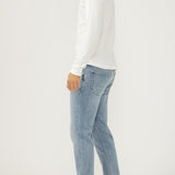 Broderick's Clothing Co. Silver Jeans Co. Machray slim straight light wash denim jeans worn by a man in profile