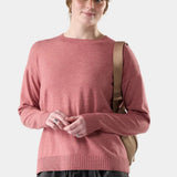 Broderick's Clothing Co. Smartwool Edgewood crew sweater in dusty rose worn by a woman with a beige cap and backpack.