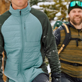 Broderick's Clothing Co. Smartwool Smartloft gloves on a man hiking in snowy mountains with touchscreen-compatible tips