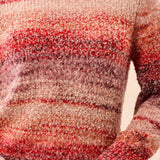 Broderick's Clothing Co. mock neck sweater in a textured space-dye knit with warm sunset red and orange hues.