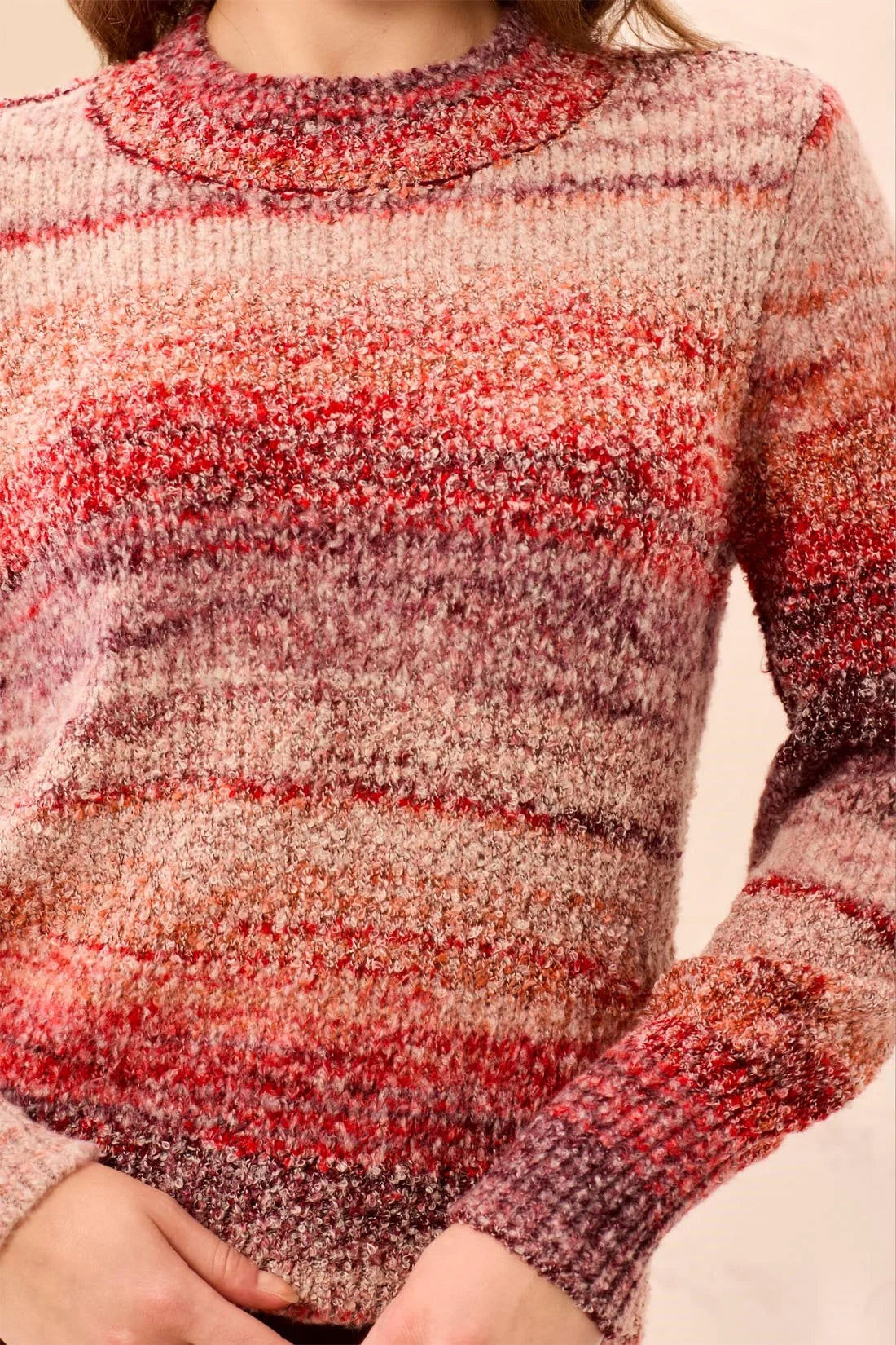 Broderick's Clothing Co. mock neck sweater in a textured space-dye knit with warm sunset red and orange hues.