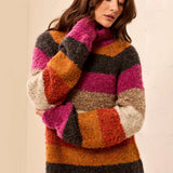 Broderick's Clothing Co. multi-colored striped bouclé turtleneck sweater with a relaxed fit and soft-touch knit.