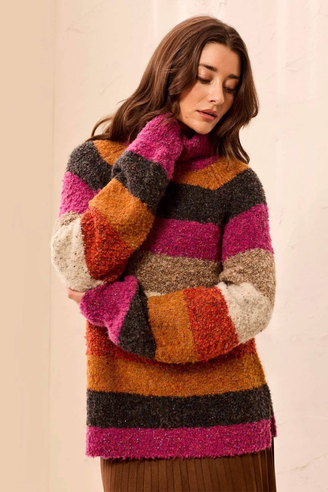 Broderick's Clothing Co. multi-colored striped bouclé turtleneck sweater with a relaxed fit and soft-touch knit.