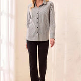 Model wearing a Broderick's Clothing Co. striped button-front shirt with wide cuffs and black trousers