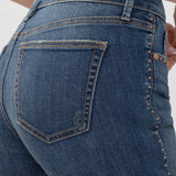 Broderick's Clothing Co. Silver Jeans Co. Suki mid-rise slim bootcut jeans in blue denim with copper stud detailing.