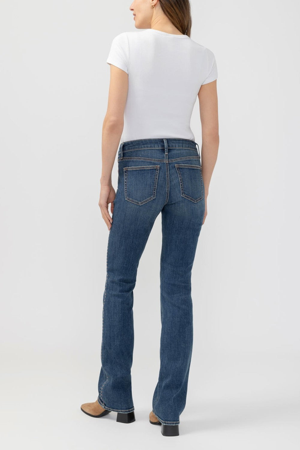 Broderick's Clothing Co. Silver Jeans Co. Suki mid-rise slim bootcut jeans in dark blue denim, back view.