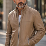Broderick's Clothing Co. Regency RENOX tan lamb leather jacket with stand-up collar worn by a man outdoors