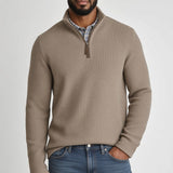Broderick's Clothing Co. Johnston & Murphy tan melange quarter-zip sweater worn by a man over a plaid shirt.