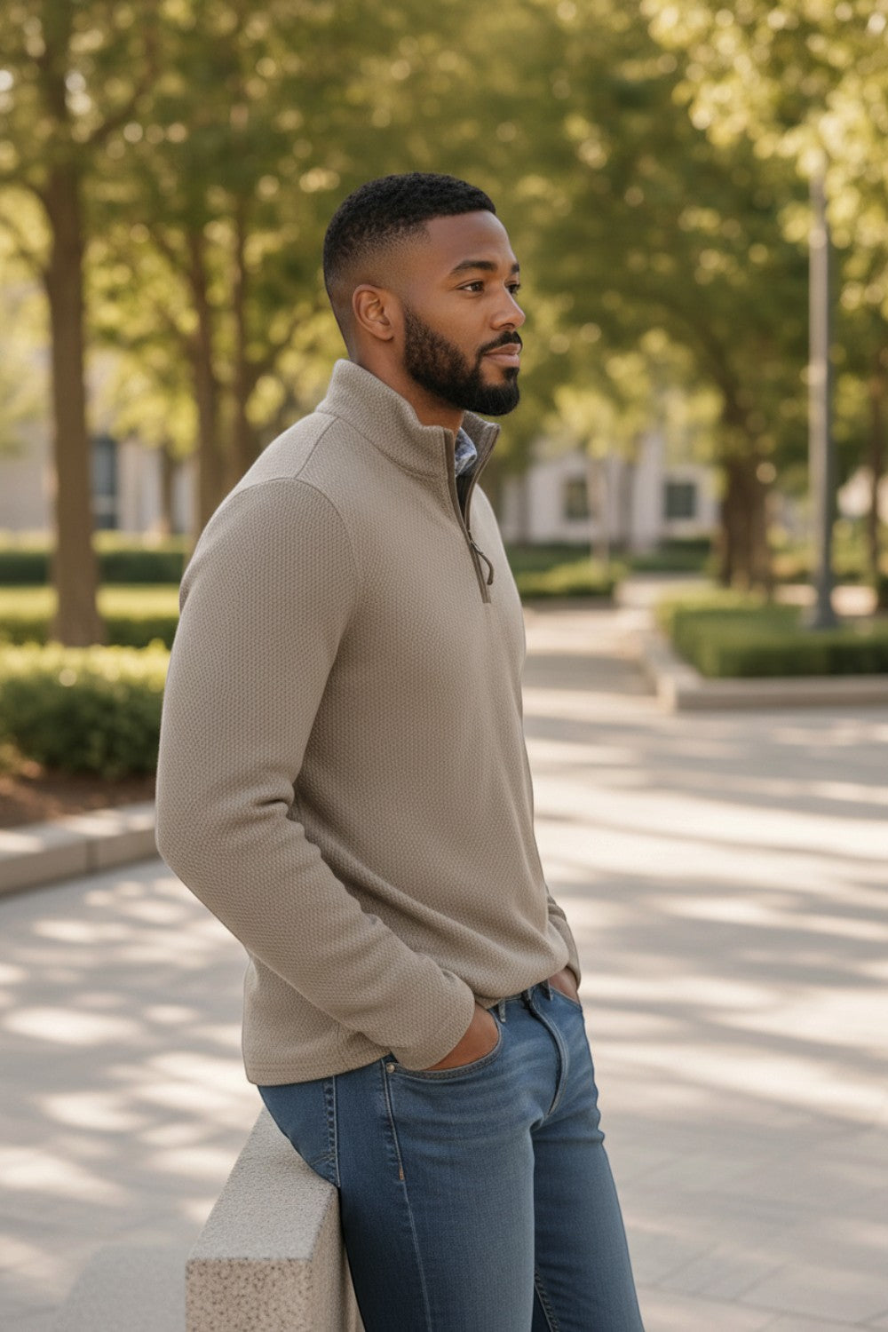 Man wearing a beige Johnston & Murphy DALTON melange quarter zip sweater from Broderick's Clothing Co. outdoors.