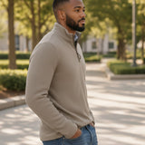 Man wearing a beige Johnston & Murphy DALTON melange quarter zip sweater from Broderick's Clothing Co. outdoors.