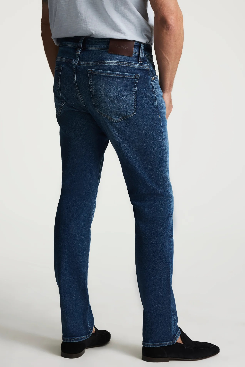 Broderick's Clothing Co. 34 Heritage medium blue tapered leg jeans with contrast stitching and back leather patch