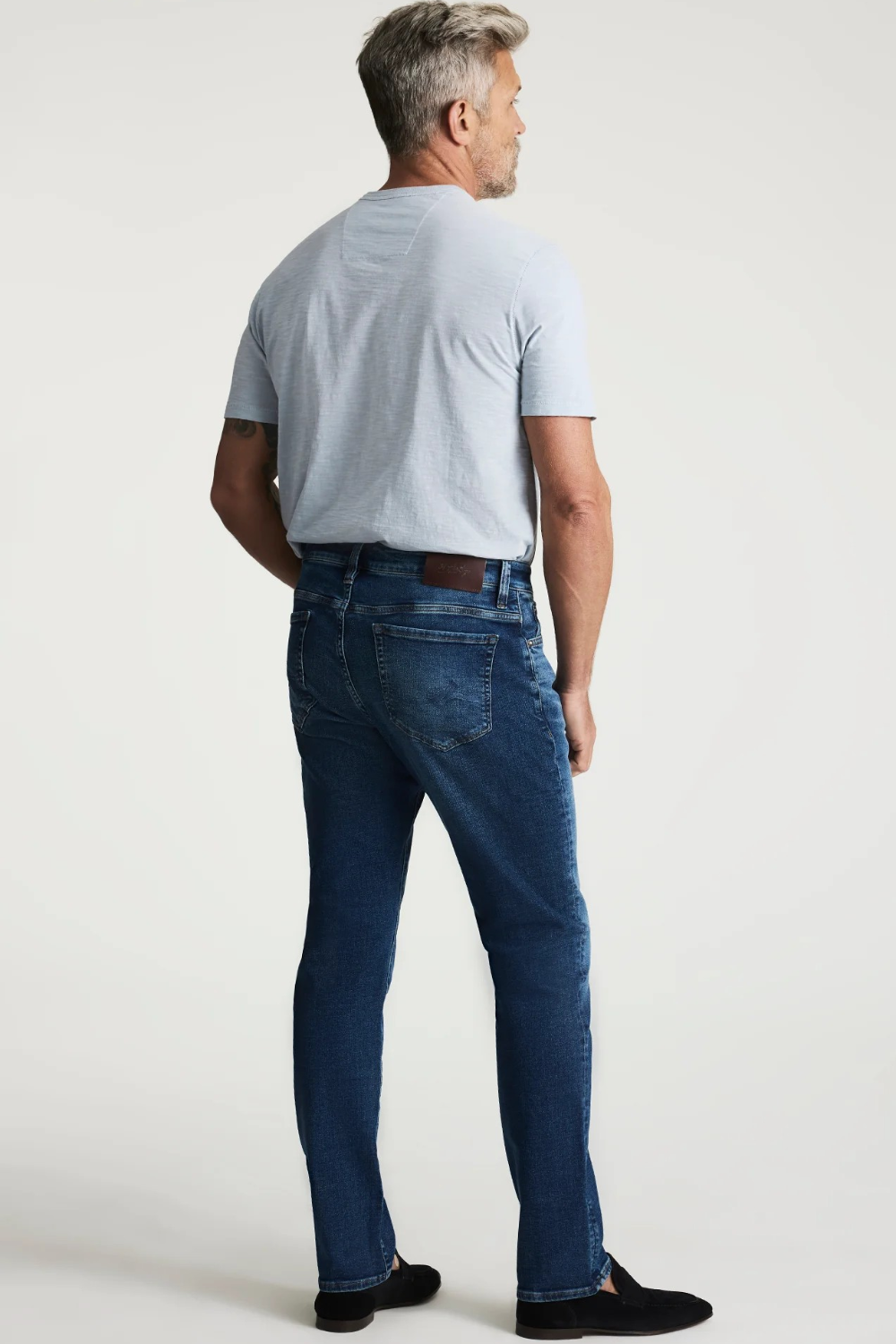 Broderick's Clothing Co. 34 Heritage medium blue tapered leg jeans with contrast stitching and leather back patch