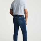 Broderick's Clothing Co. 34 Heritage medium blue tapered leg jeans with contrast stitching and leather back patch