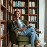 Broderick's Clothing Co. Shannon Passero Lodge Cardigan made from upcycled flannel and denim worn by a woman reading.