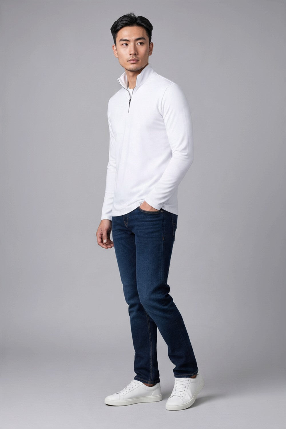 Broderick's Clothing Co. Au Noir white mock neck knit pullover with quarter zip worn by a male model with blue jeans