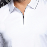 Broderick's Clothing Co. white long sleeve knit polo with a structured collar and quarter-zip detail on a model.
