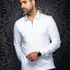 Broderick's Clothing Co. model wearing a white long-sleeve knit polo with a structured collar and zip detail.
