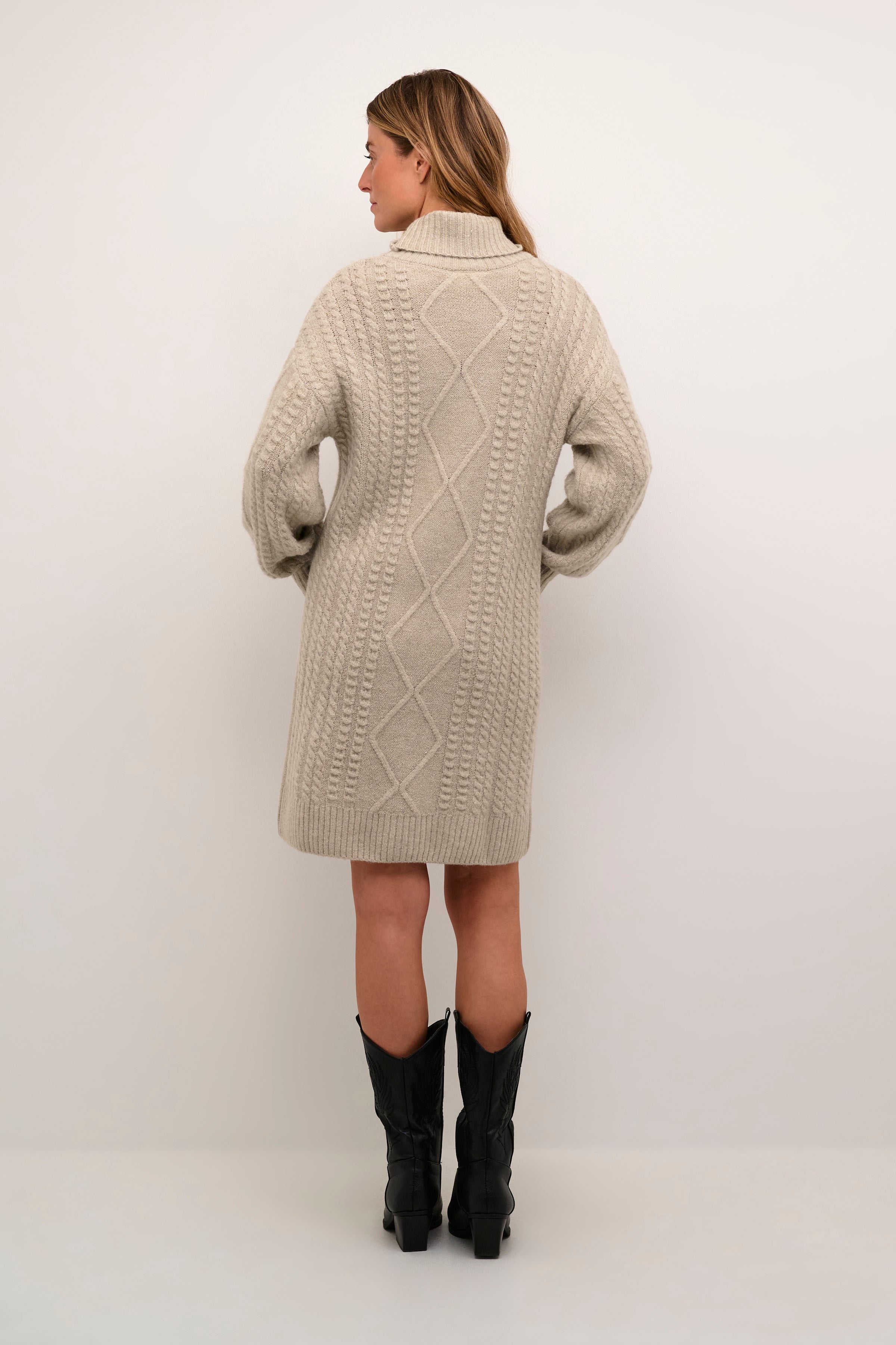 Indulge in the cozy and chic comfort of our Cream Pumpkin Knit Dress. Made with premium knit fabric, this dress features a flattering pumpkin shape and a neutral cream colour that pairs perfectly with any accessories. Stay stylish and warm this season with our must-have dress!