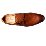 The Florsheim Sorrento Plain Toe Single Monk Strap features a rich leather upper with an elegant buckle and a sleek silhouette. The convenience of a slip on is further enhanced by the comfort of its fully cushioned leather covered footbed and soft leather linings.