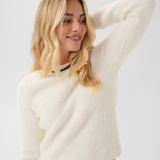 Broderick's Clothing Co. cream long-sleeve knit sweater with a round neckline and subtle textured surface detail.