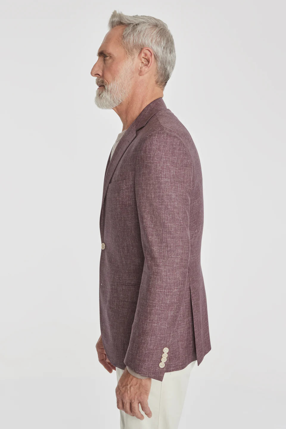 This Midland solid berry blazer is&nbsp;crafted from supersoft and light wool woven in Italy. This fabric allows the wearer to enjoy a crease free linen look thanks to the different colors of yarns used in this 100% worsted wool fabric.
