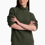Woman wearing a green sweater with a white background