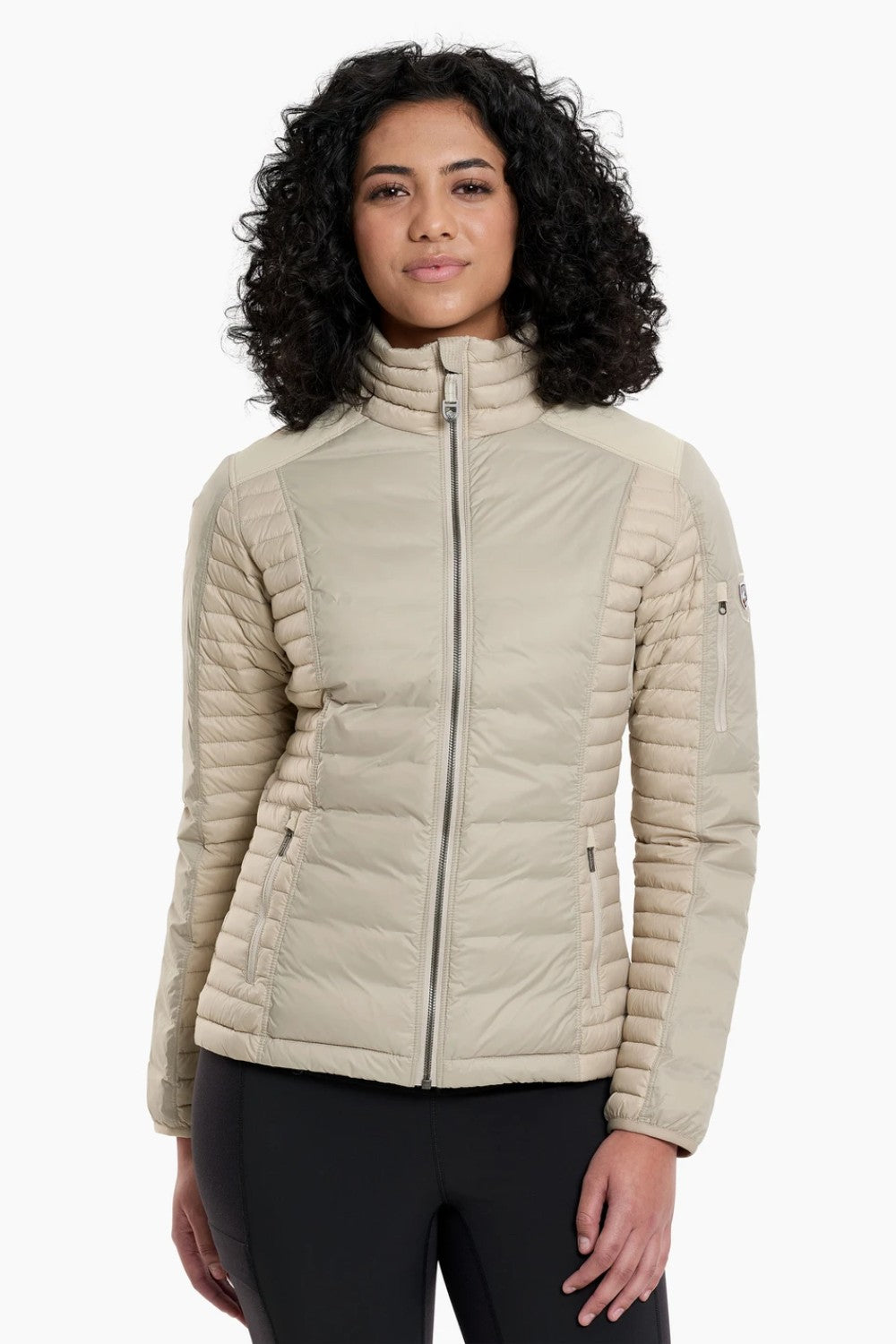 The remarkable SPYFIRE Down Jacket is lighter, softer, and stronger. One look and you’ll know it’s different. Features more down at your core and less under your arms and high sweat zones where you need the freedom to move. Temperature-regulating knit underarm gussets release excess heat for sustained comfort during high-output activity. Reinforced overlays provide durability while our 3D patterning supplies the ideal feminine fit.&nbsp;