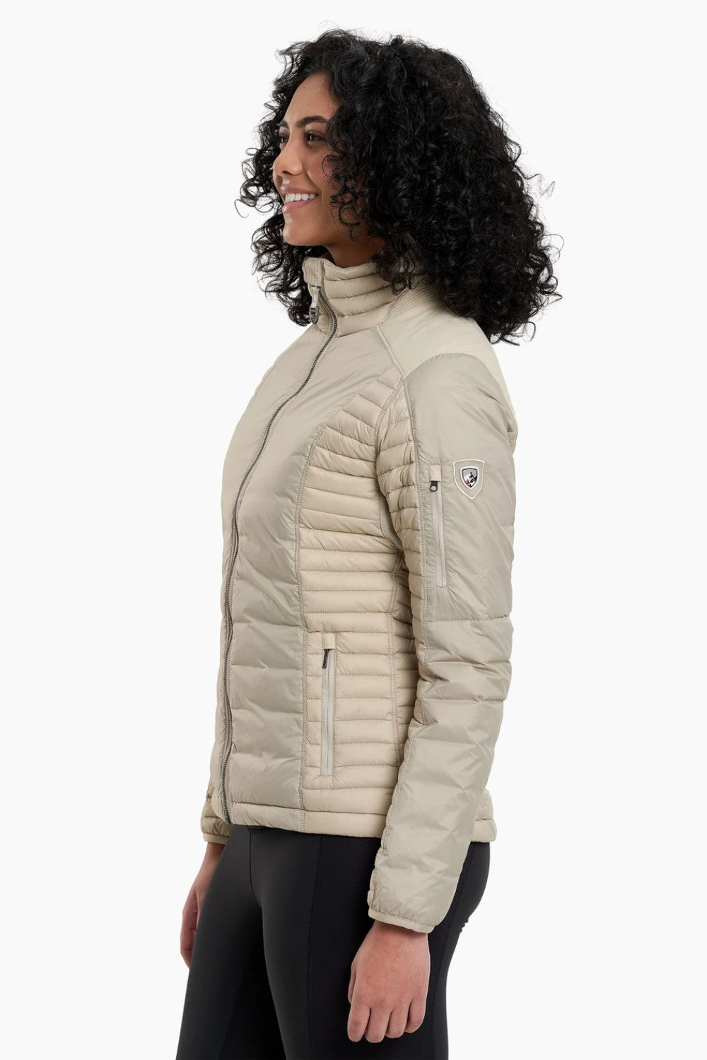 The remarkable SPYFIRE Down Jacket is lighter, softer, and stronger. One look and you’ll know it’s different. Features more down at your core and less under your arms and high sweat zones where you need the freedom to move. Temperature-regulating knit underarm gussets release excess heat for sustained comfort during high-output activity. Reinforced overlays provide durability while our 3D patterning supplies the ideal feminine fit.&nbsp;