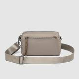 The Louenhide Rowie Nylon Crossbody Bag is the practical, everyday accessory you've been searching for. Embrace an organized dream with multiple internal and external pockets and a stylish matching cardholder. The Rowie's minimalist&nbsp;design is enhanced by the gunmetal detailing - adding the perfect touch of contemporary edge to its classic silhouette.&nbsp; Whether you're exploring the city or embarking on an adventure, this crossbody bag effortlessly complements your capsule wardrobe. 