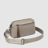 The Louenhide Rowie Nylon Crossbody Bag is the practical, everyday accessory you've been searching for. Embrace an organized dream with multiple internal and external pockets and a stylish matching cardholder. The Rowie's minimalist&nbsp;design is enhanced by the gunmetal detailing - adding the perfect touch of contemporary edge to its classic silhouette.&nbsp; Whether you're exploring the city or embarking on an adventure, this crossbody bag effortlessly complements your capsule wardrobe. 