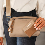 The Louenhide Rowie Nylon Crossbody Bag is the practical, everyday accessory you've been searching for. Embrace an organized dream with multiple internal and external pockets and a stylish matching cardholder. The Rowie's minimalist&nbsp;design is enhanced by the gunmetal detailing - adding the perfect touch of contemporary edge to its classic silhouette.&nbsp; Whether you're exploring the city or embarking on an adventure, this crossbody bag effortlessly complements your capsule wardrobe. 