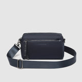 The Louenhide Rowie Nylon Crossbody Bag is the practical, everyday accessory you've been searching for. Embrace an organized dream with multiple internal and external pockets and a stylish matching cardholder. The Rowie's minimalist&nbsp;design is enhanced by the gunmetal detailing - adding the perfect touch of contemporary edge to its classic silhouette.&nbsp; Whether you're exploring the city or embarking on an adventure, this crossbody bag effortlessly complements your capsule wardrobe. 