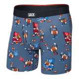 Blue boxer briefs with cartoon character pattern and Saxx branding on a white background