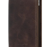 Its slim profile makes the Slimwallet fit perfectly into every pocket. The open exterior is cut extra wide to hold cards, banknotes and receipts. The Card protector mechanism allows you to slide out cards with one simple motion, while the aluminium protects your cards from bending, breaking and unwanted wireless communication.