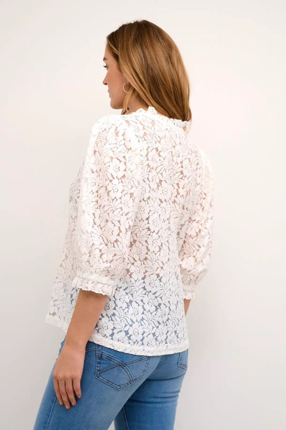 This stylish knitted blouse features an A-shape fit and hip-length cut, perfect for a chic, casual look. The short sleeves extend below the elbow, adding a unique touch to its design. Pair with fitted jeans or a flowing skirt for a complete outfit.