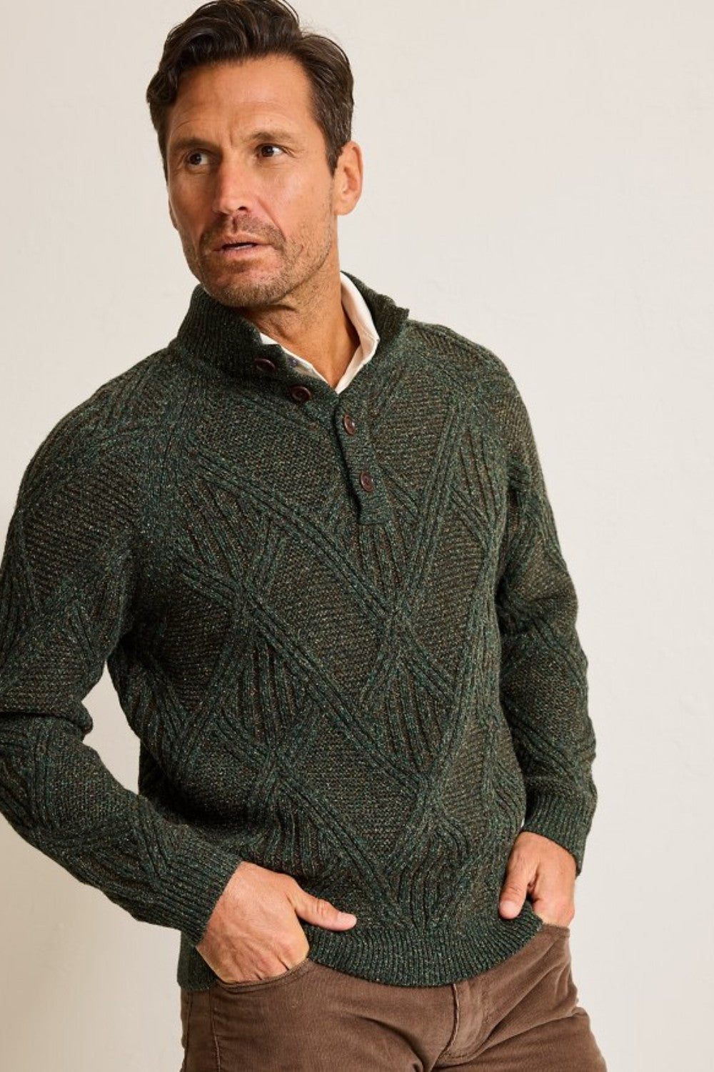 A luxurious multi-tone blend, featuring silk and Merino wool, lends a sophisticated note to this cable-knit sweater, complete with a wooden button placket that embraces rugged appeal.