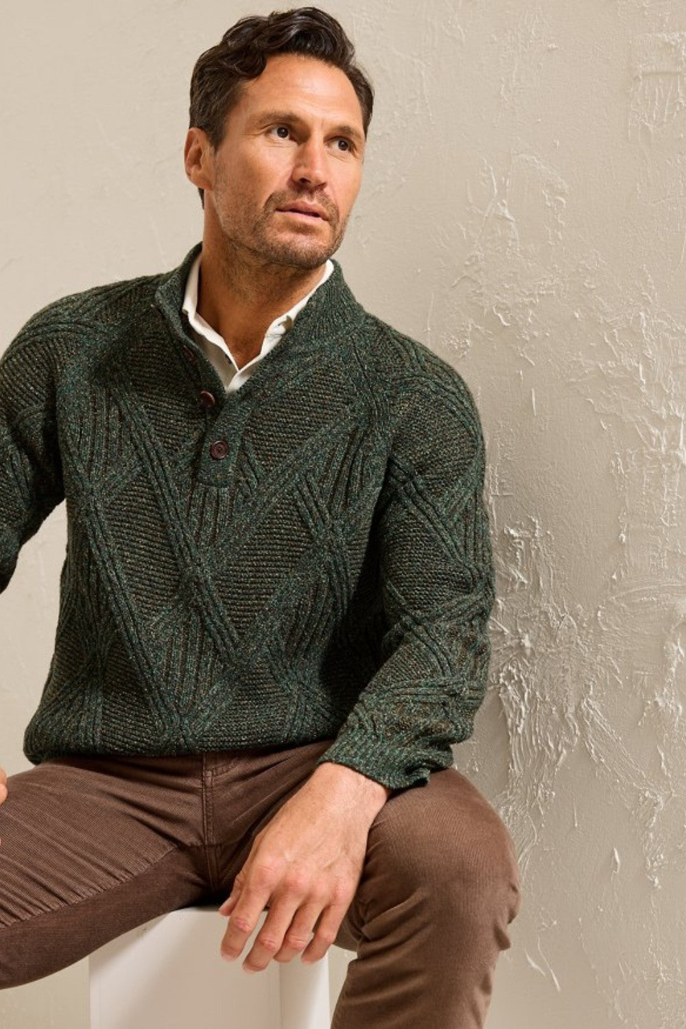 A luxurious multi-tone blend, featuring silk and Merino wool, lends a sophisticated note to this cable-knit sweater, complete with a wooden button placket that embraces rugged appeal.