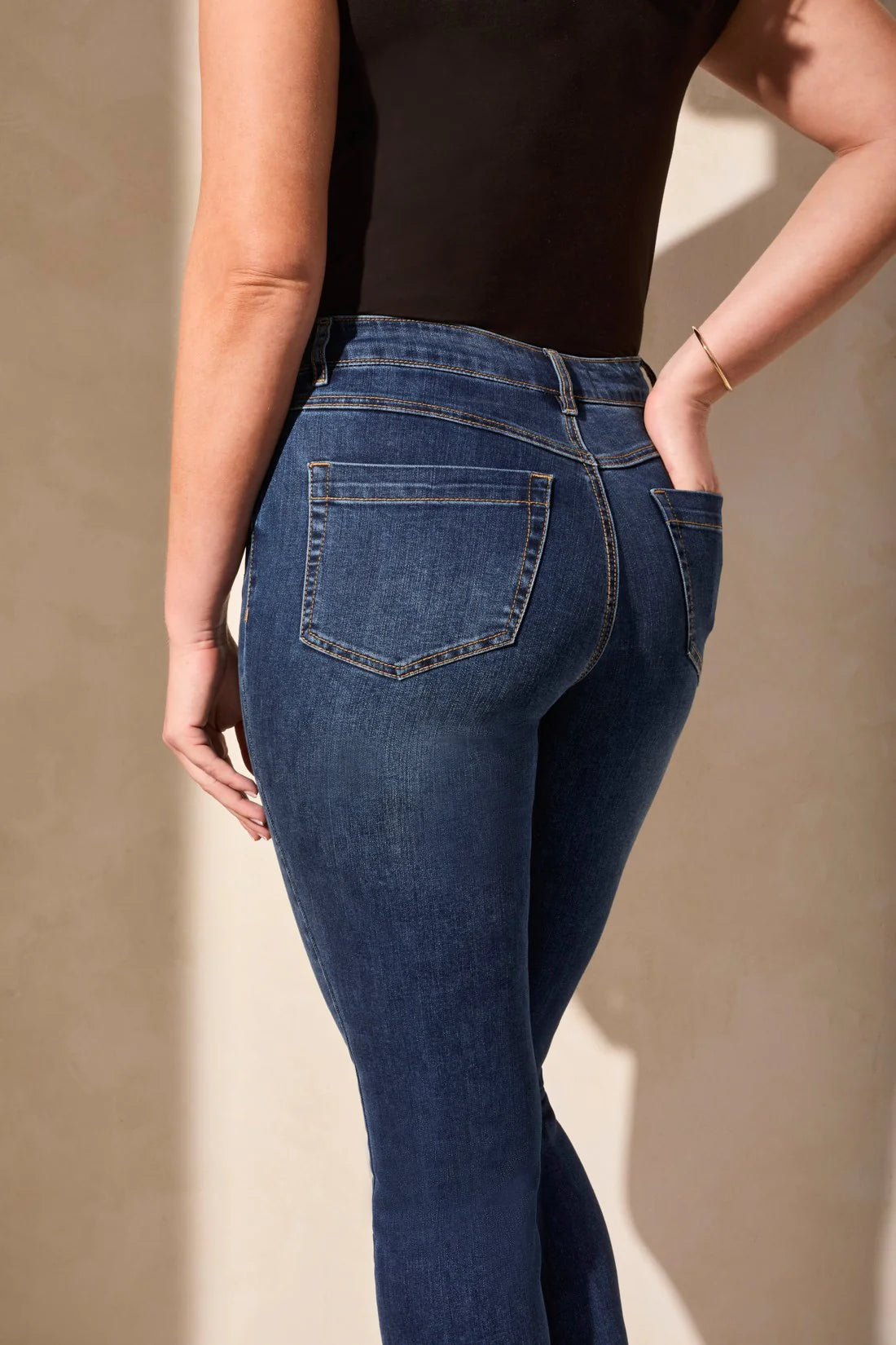 Infuse your day with casual comfort in these mid-rise jeans, crafted from stretch denim. The straight-leg cut features an elegant crease detail along the leg for a poised finish, while the well-placed pockets offer practicality without compromising style.