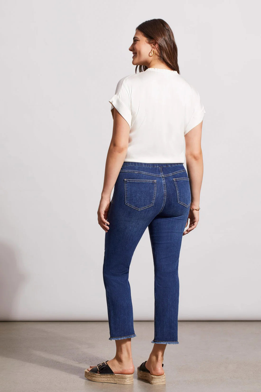 The thoughtfully designed jean is slim-fitting through the hip, butt and thigh with a straight leg.
