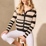 Top your ensemble with this cozy button-front cardigan showcasing a statement stripe pattern. The boxy fit keeps it comfortable as you layer it over your look, and long sleeves keep you covered.