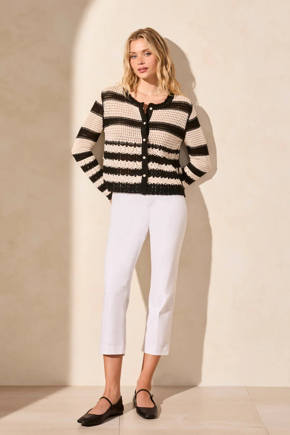 Top your ensemble with this cozy button-front cardigan showcasing a statement stripe pattern. The boxy fit keeps it comfortable as you layer it over your look, and long sleeves keep you covered.