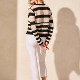 Top your ensemble with this cozy button-front cardigan showcasing a statement stripe pattern. The boxy fit keeps it comfortable as you layer it over your look, and long sleeves keep you covered.